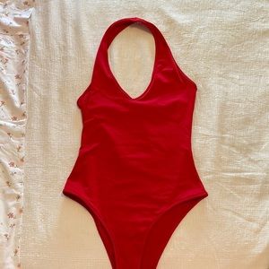 Red size M halter body suit. Unknown brand but great quality.